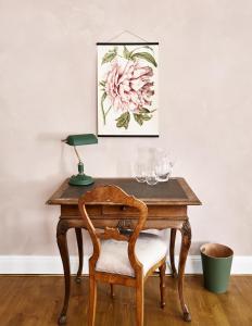 an old wooden table with a chair and a lamp at Zámek Žďár in Žďár nad Sázavou