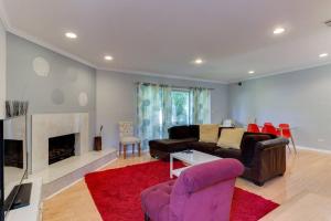 a living room with a couch and a fireplace at Woodland Hills Charmer in Los Angeles