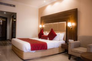 Ένα ή περισσότερα κρεβάτια σε δωμάτιο στο Hotel Highway Hari +30 φωτογραφίες