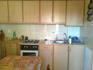 A kitchen or kitchenette at Marcsi Apartman