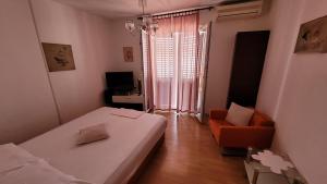 Posteľ alebo postele v izbe v ubytovaní Apartmani Križanac