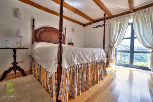 Ένα ή περισσότερα κρεβάτια σε δωμάτιο στο Quinta da Bouça - Agroturismo