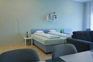 Postel nebo postele na pokoji v ubytování Purple Apartman