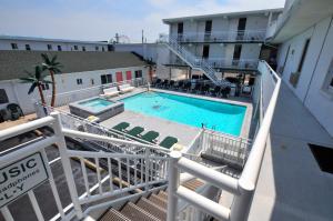 a swimming pool on the balcony of a hotel at Riviera Resort & Suites in Wildwood