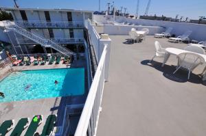 a balcony with a pool on a cruise ship at Riviera Resort & Suites in Wildwood