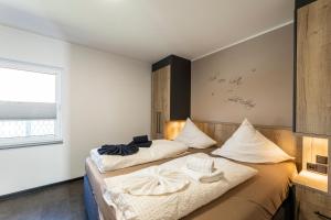 Postel nebo postele na pokoji v ubytování Sommerwind Alfonso Wohnung 1 - Urlaub mit Hund