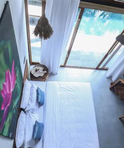 Letto o letti in una camera di Satya Boutique Resort & Spa