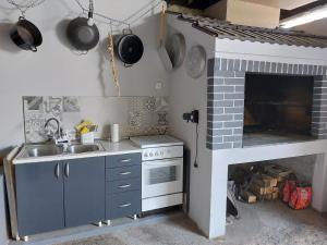 Kuchyň nebo kuchyňský kout v ubytování Apartman Alberta