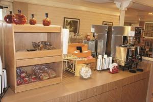 a kitchen with a counter with some food on it at Days Inn by Wyndham Augusta Washington Rd in Augusta