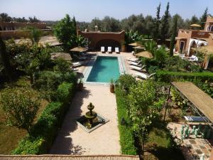 an aerial view of a house with a swimming pool at Palais Mandarine in Taroudant