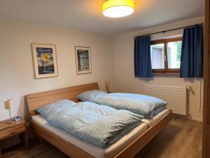 a bedroom with two beds with blue sheets at Voa Crestas 7 (715 He) in Sporz