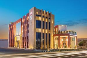 a rendering of a building on a city street at Best Western Plus Al Qurayyat City Center in Al Qurayyat