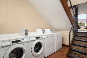 a laundry room with a washer and dryer at Quality Inn Wenatchee-Leavenworth in Wenatchee