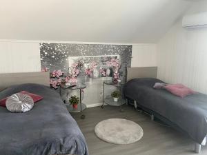 A bed or beds in a room at Maria Vendéghaz