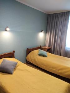 Postel nebo postele na pokoji v ubytování Hotel Trias