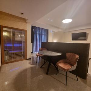 TV a/nebo společenská místnost v ubytování Figaro Apartaments