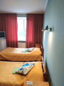 Postel nebo postele na pokoji v ubytování Hotel Trias