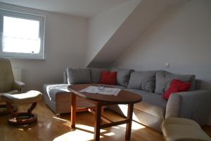 a living room with a couch and a table at Frankenau Fewo Kellerwald in Frankenau