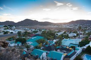 an aerial view of a small town with blue roofs at Blue Diamond Lodge & Spa in Springbok
