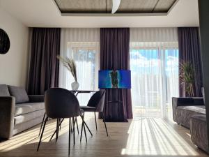 Χώρος καθιστικού στο Apartamentai Bangų namai +2 φωτογραφίες