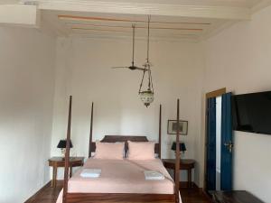 Postel nebo postele na pokoji v ubytování Suítes Casa da Colônia