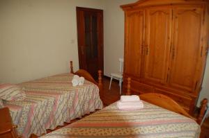 Un pat sau paturi într-o cameră la Apartamentos La Luz de Reinosa 2