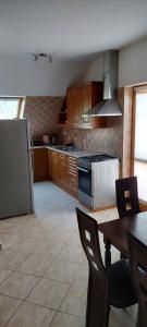 A kitchen or kitchenette at Szikszai Apartman