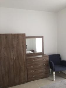 Кровать или кровати в номере Suluca Homes