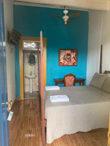 Postel nebo postele na pokoji v ubytování Suítes Casa da Colônia