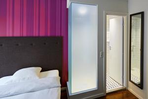 Postel nebo postele na pokoji v ubytování First Hotel Grand