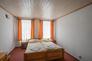 Postel nebo postele na pokoji v ubytování Pension Herman