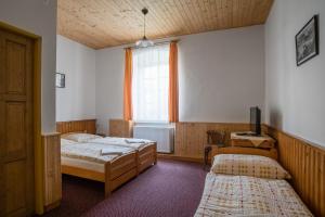 Postel nebo postele na pokoji v ubytování Pension Herman