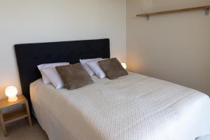 Ένα ή περισσότερα κρεβάτια σε δωμάτιο στο Marina Resort A7