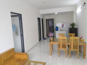 a kitchen and dining room with a table and chairs at Thao Nguyen Homestay in Thôn Mỹ Phước