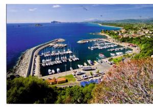 an aerial view of a marina with boats in the water at Casa Navarra in Santa Maria Navarrese