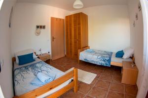 a small room with two beds in a room at House /Villa Maja in Ližnjan +51 photos