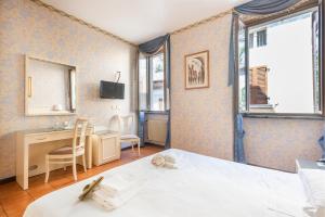 Postel nebo postele na pokoji v ubytování Hotel Le Palme