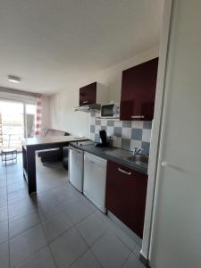 a kitchen with a sink and a counter top at Vacances détente in Argelès-sur-Mer