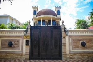 a gate to a building with a dome on top at Casablanca in Adler