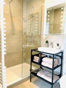 a bathroom with a sink and a shower at Innerste Getaway in Langelsheim