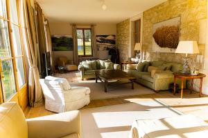 a large living room with couches and a table at Chateau d'Echenevex - Luxury Escape near Geneva in Échenevex