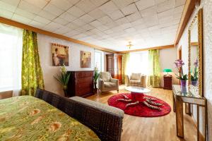 a bedroom with a bed and a red rug at Old villa Kaprice Baltic Beach in Jūrmala