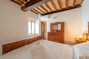 Postel nebo postele na pokoji v ubytování Casa Garoselli
