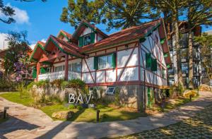 una representación de una casa con la palabra bahía delante de ella en Cityhome Bav Residenz Gramado, en Gramado