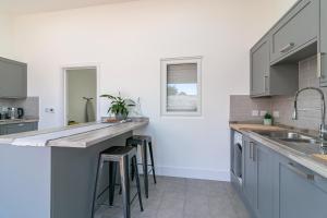 Kuchyň nebo kuchyňský kout v ubytování Archers Lodge