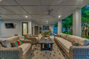 a living room with couches and a table at Endless Summer in Sarasota