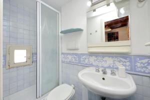 a bathroom with a sink and a toilet and a mirror at La Dimora Pantheon in Rome +24 photos