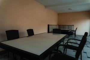 an empty room with a table and chairs at Holiday Home Rozić - Villa with private seasonal heated pool in Mostar +25 photos