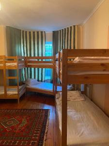 a room with two bunk beds and a window at Hostel 888 in Almaty