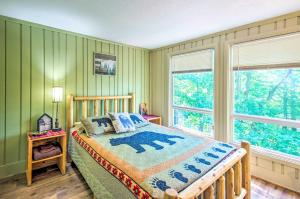 a bedroom with a bed and a large window at The Dodge Lodge Steps to Massanutten Adventures! in McGaheysville